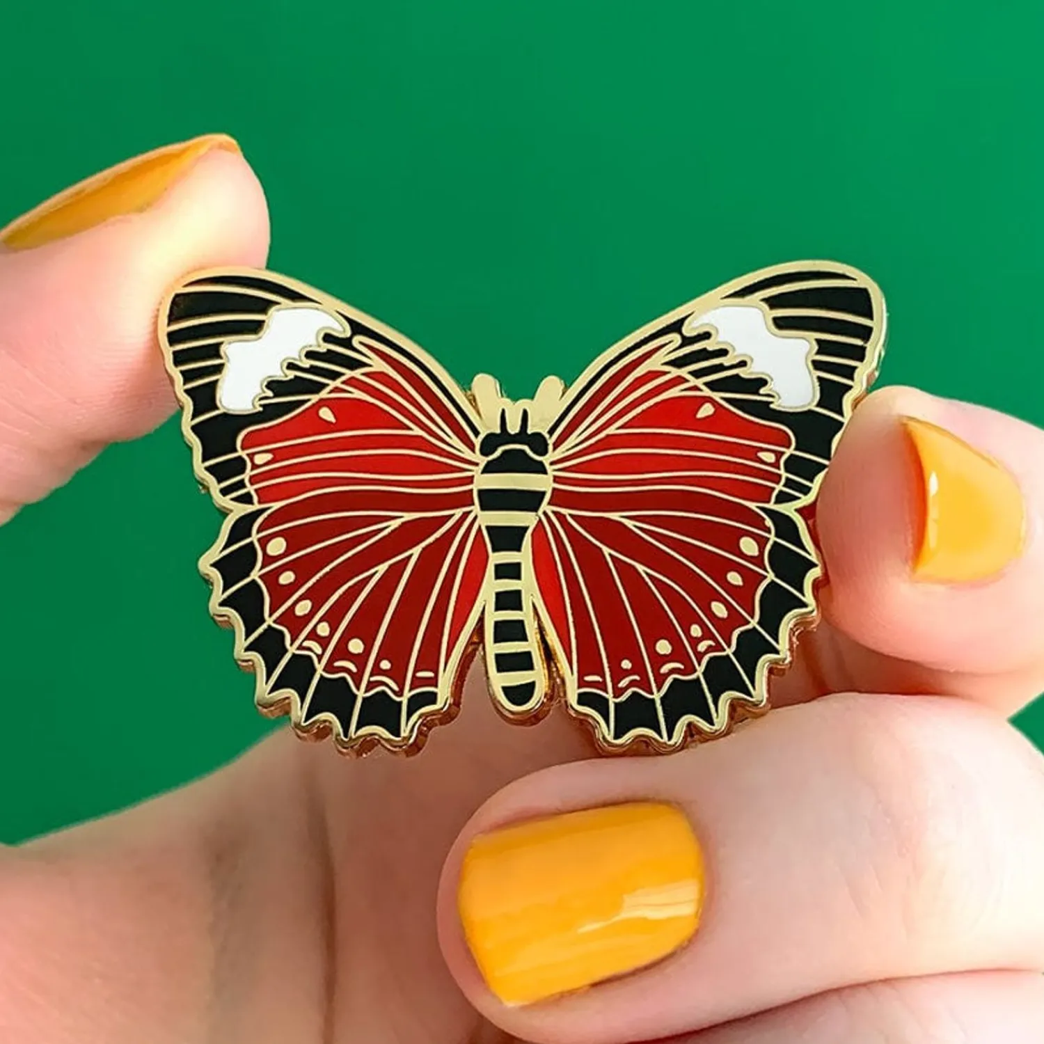 Wings Laced In Red Enamel Pin^Erstwilder Best